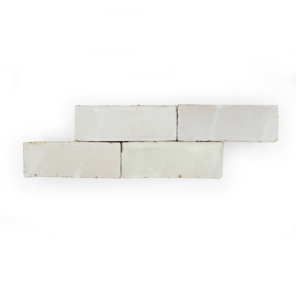 Four Pearl Grey (2x6) tiles by New York Cement Tile are stacked in a staggered pattern on a white background.
