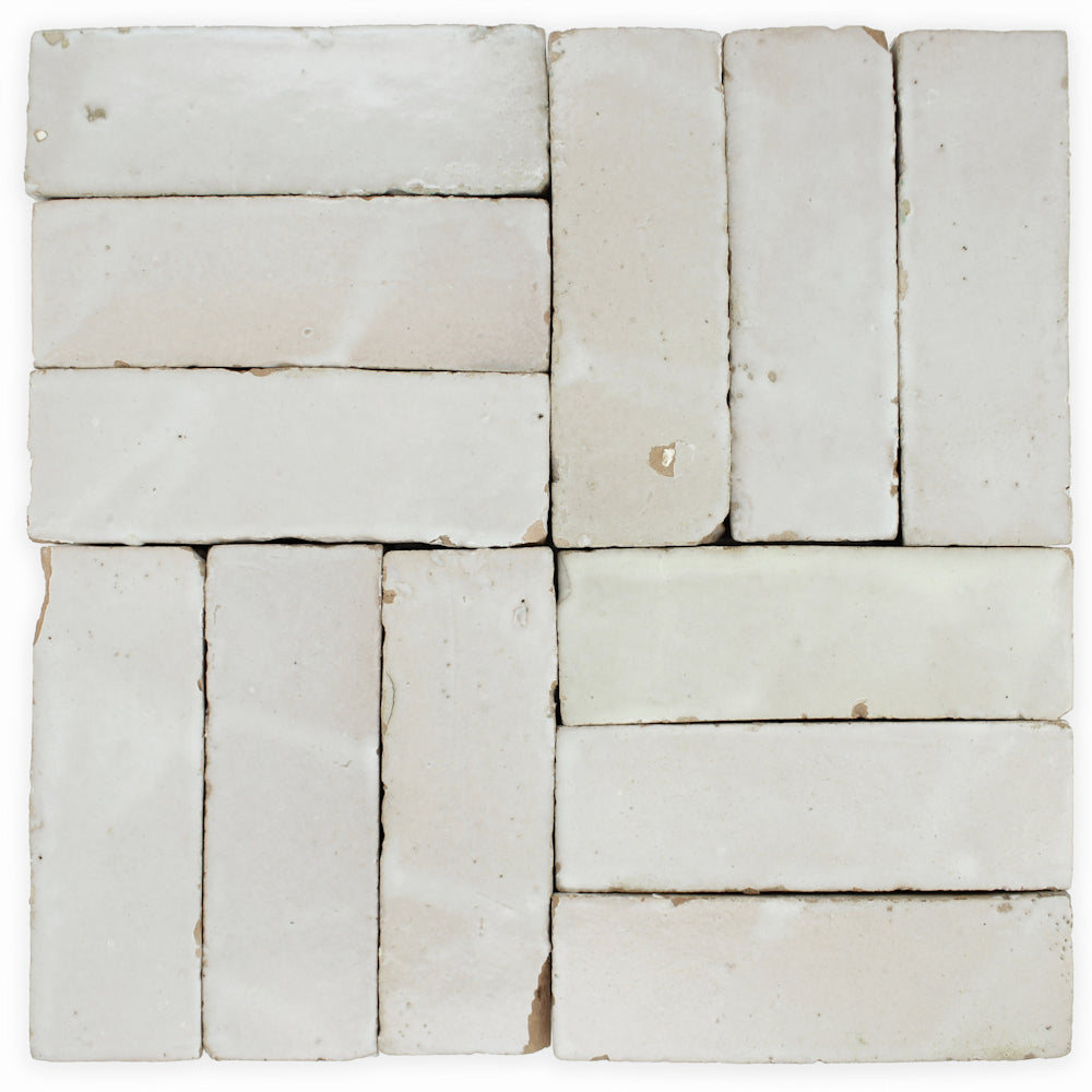 Pearl Grey (2x6) Extra Sample tiles by New York Cement Tile have an off-white hue with handcrafted surface variations.