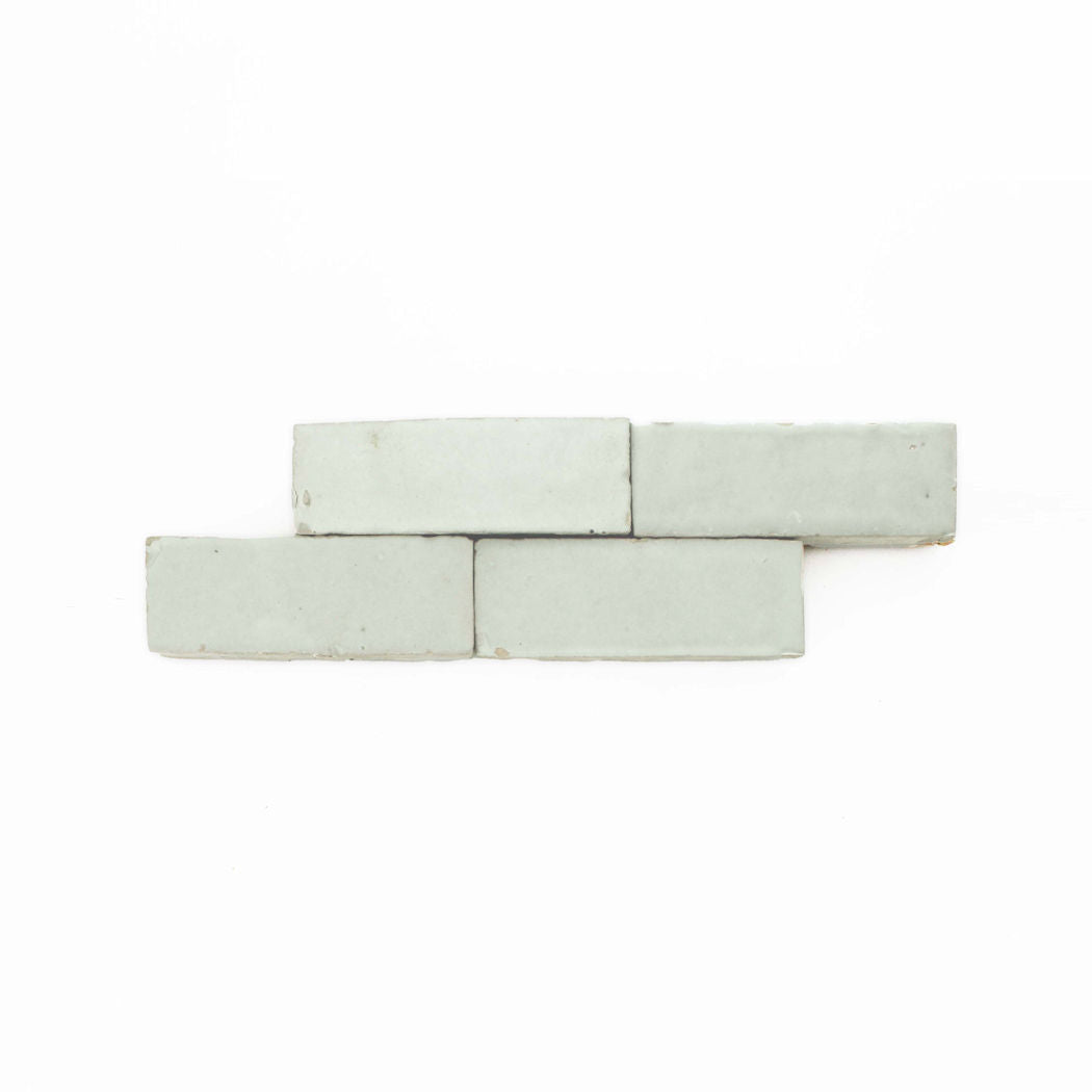 Three Mint Frost (2x6) tiles by New York Cement Tile are stacked in a staggered layout on a white background.