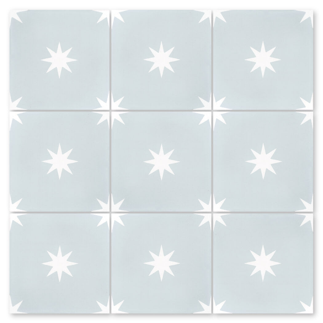 The N20-572 Baby Blue sample by New York Cement Tile features nine tiles with white eight-point stars in a geometric pattern.