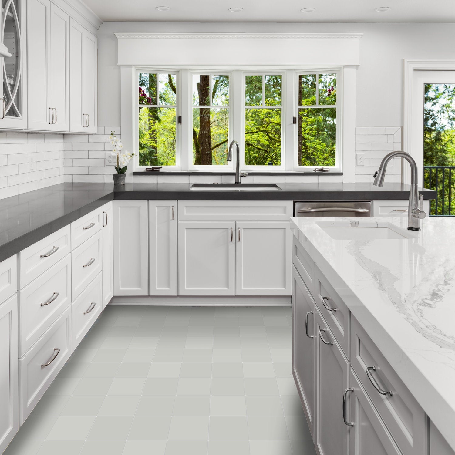 Bright modern kitchen featuring New York Cement Tile 2219-Solid sample, white cabinets, black counters, and big windows.