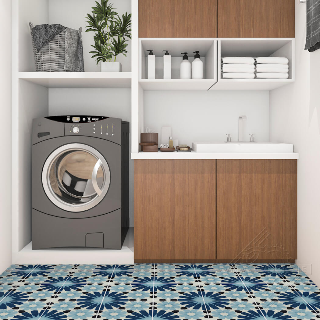 Modern laundry room with a washer, sink, wood cabinets, towels, and New York Cement Tile N20-029 Blue for sustainability.