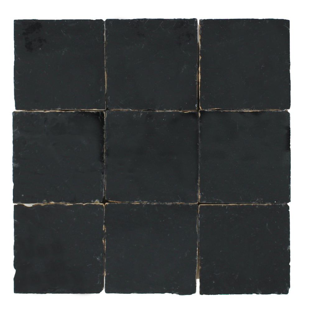 Nine Black Onyx samples by New York Cement Tile, handcrafted with rough, uneven edges, arranged in a 3x3 grid.
