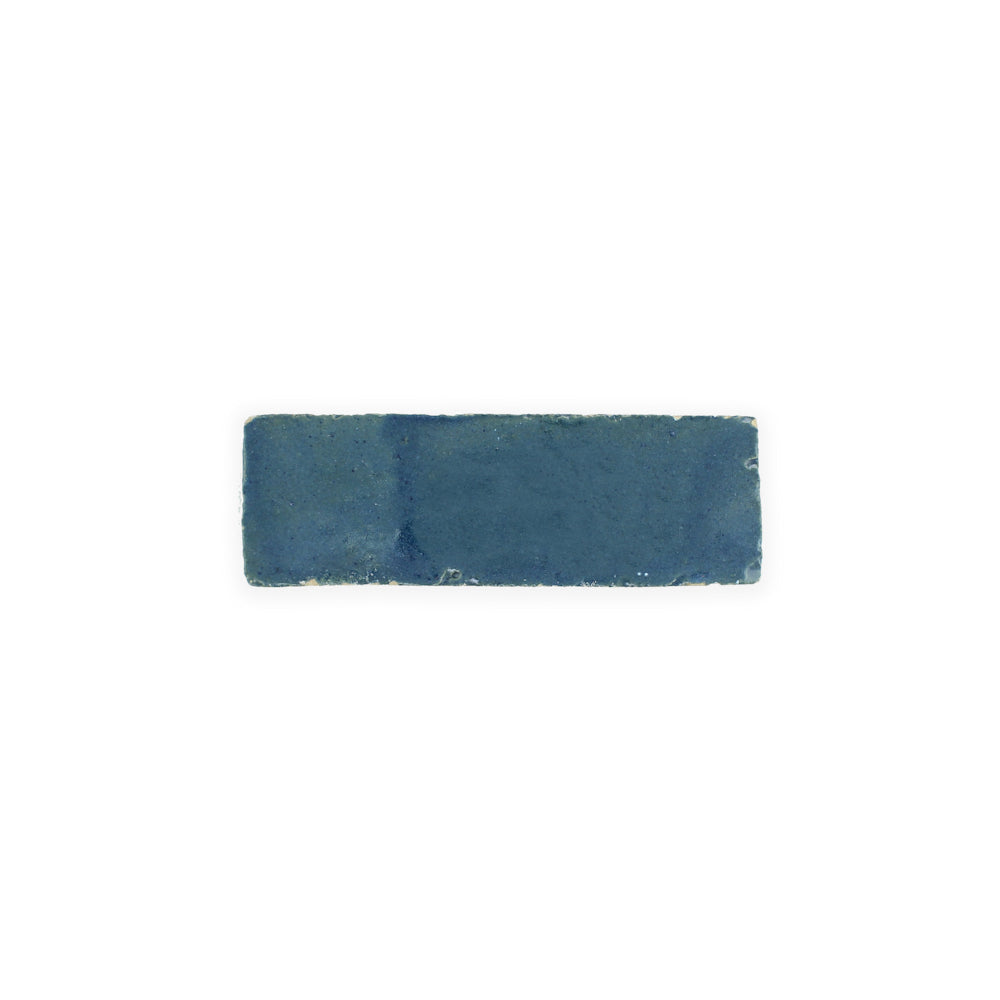 A single Sea Breeze (2x6) Zellige tile by New York Cement Tile, blue and textured, centered on a white background.