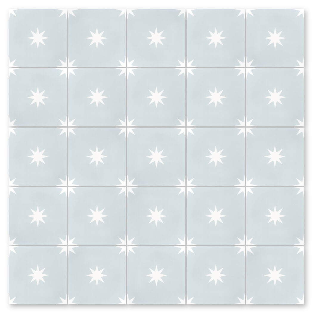 Grid of N20-572 Baby Blue tiles by New York Cement Tile, each with a white eight-pointed star in the center.