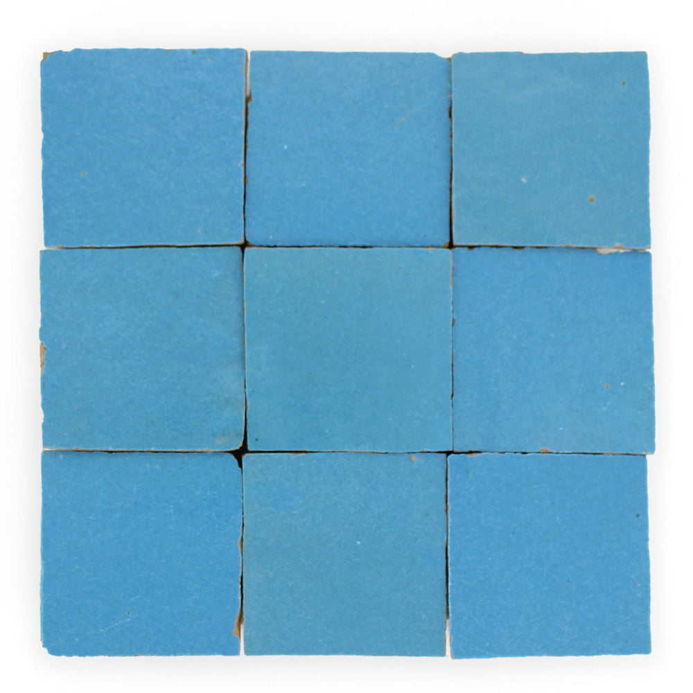 Nine Azure 2X2 tiles by New York Cement Tile in a 3x3 grid, with slight gaps and worn edges for an artisanal look.