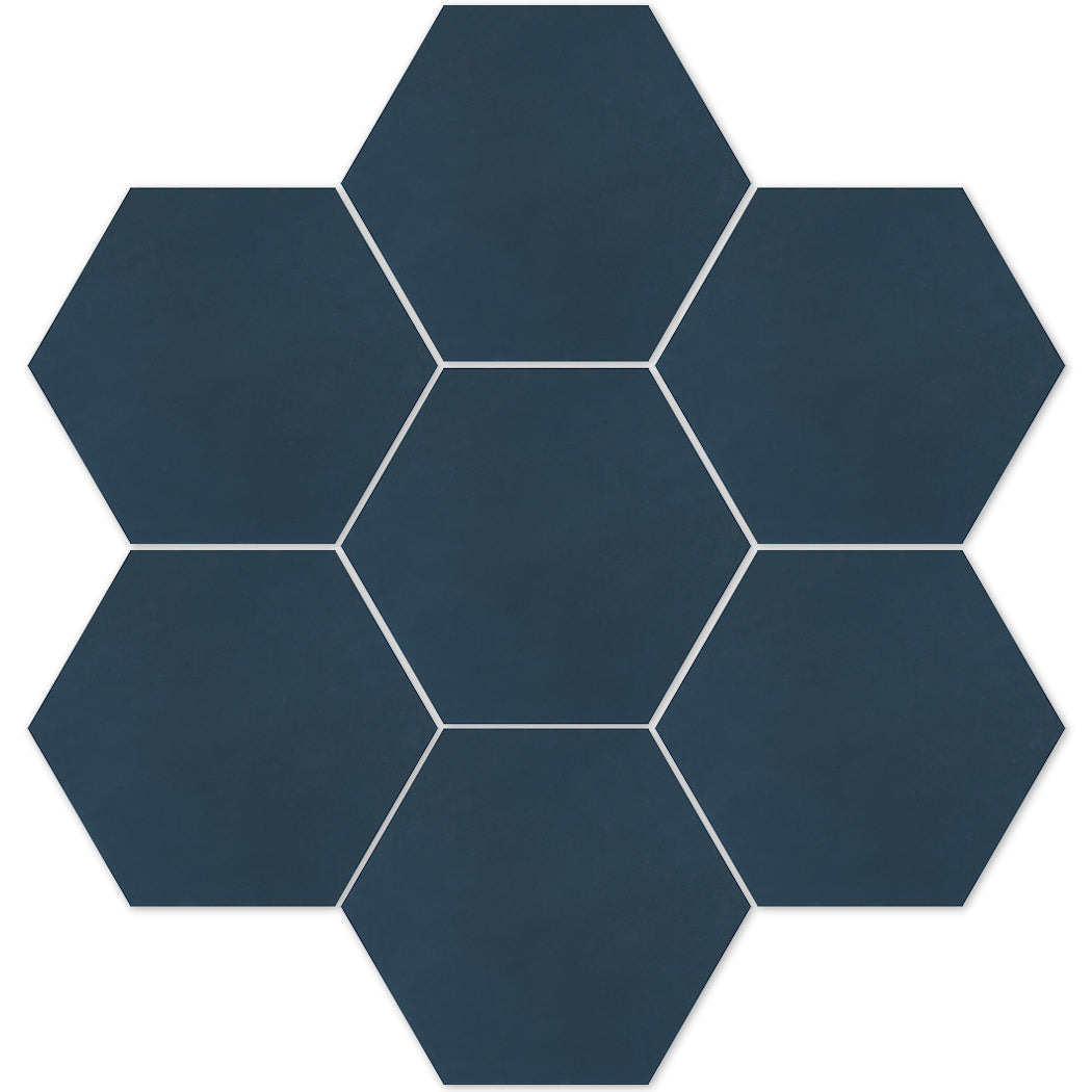Seven Solid Hex-Navy cement tiles by New York Cement Tile in a honeycomb pattern on a white background.
