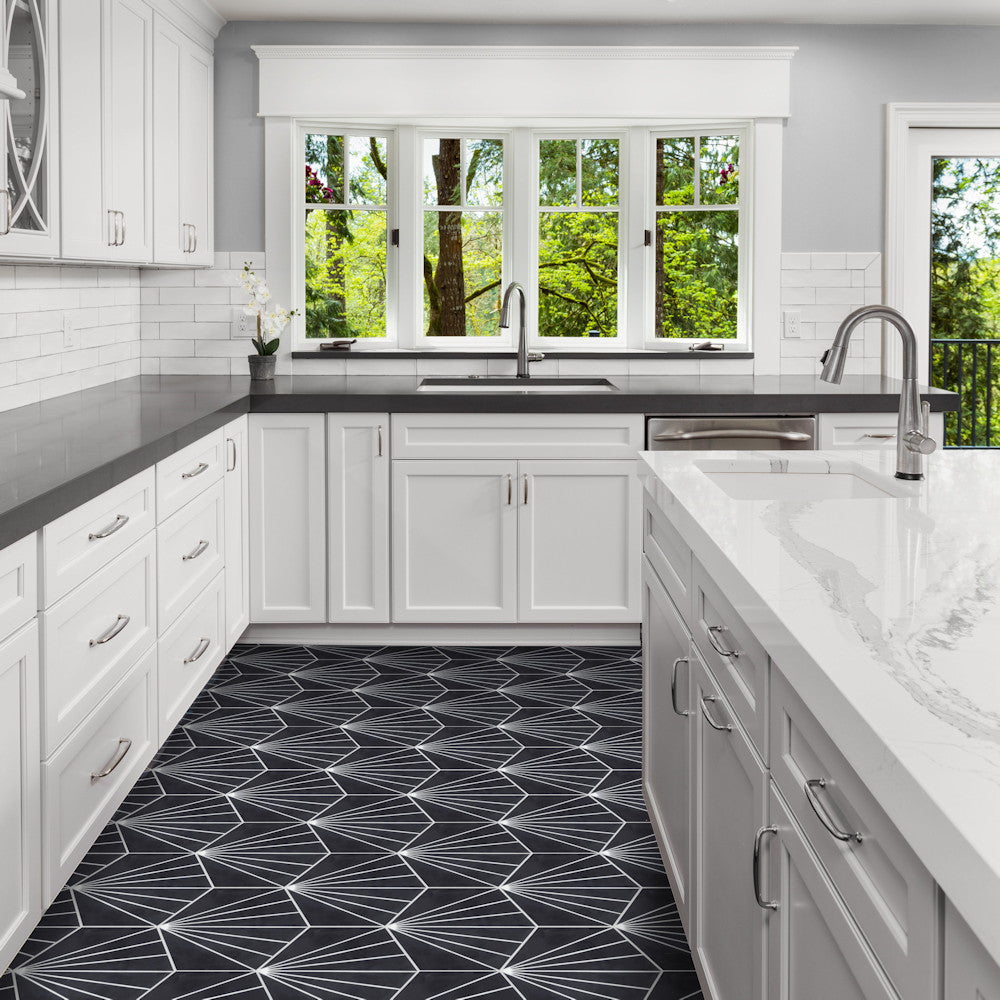 Modern kitchen with white cabinets, NH23-036 Black tile by New York Cement Tile, large windows, and green views.