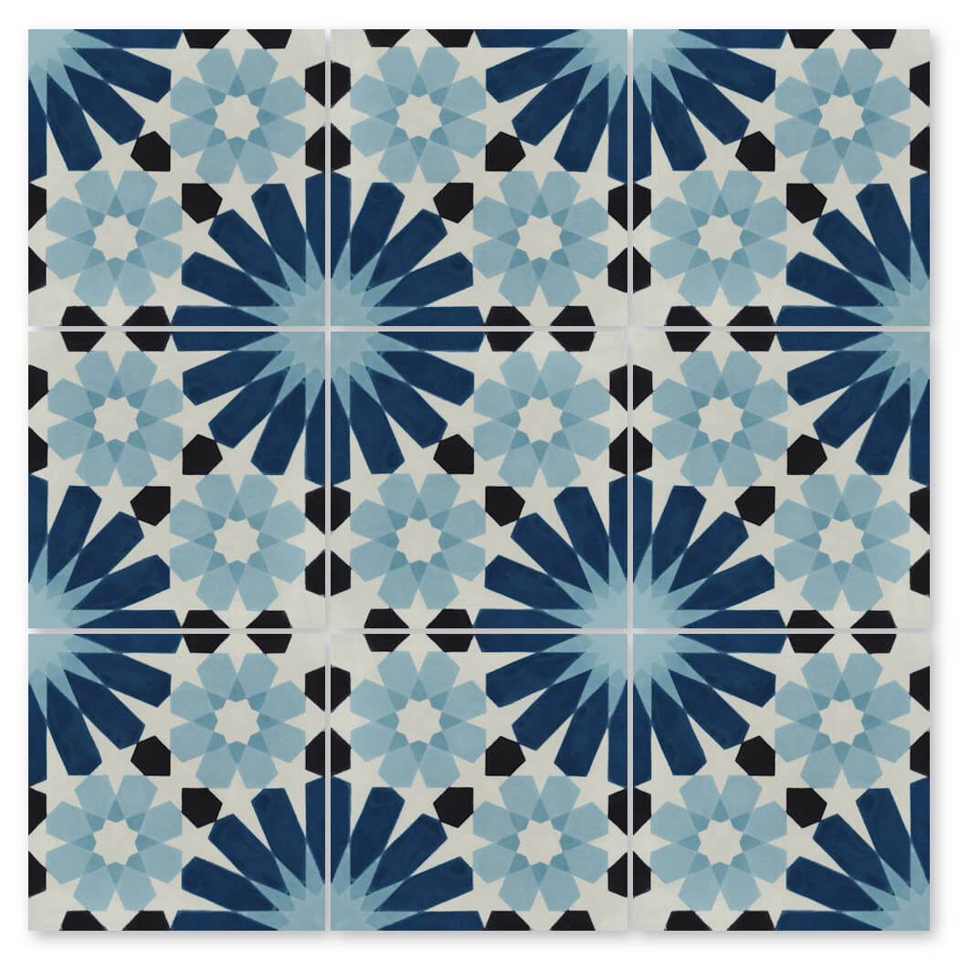 N20-029 Blue sample by New York Cement Tile: nine square tiles with a blue, black, and white geometric starburst pattern.
