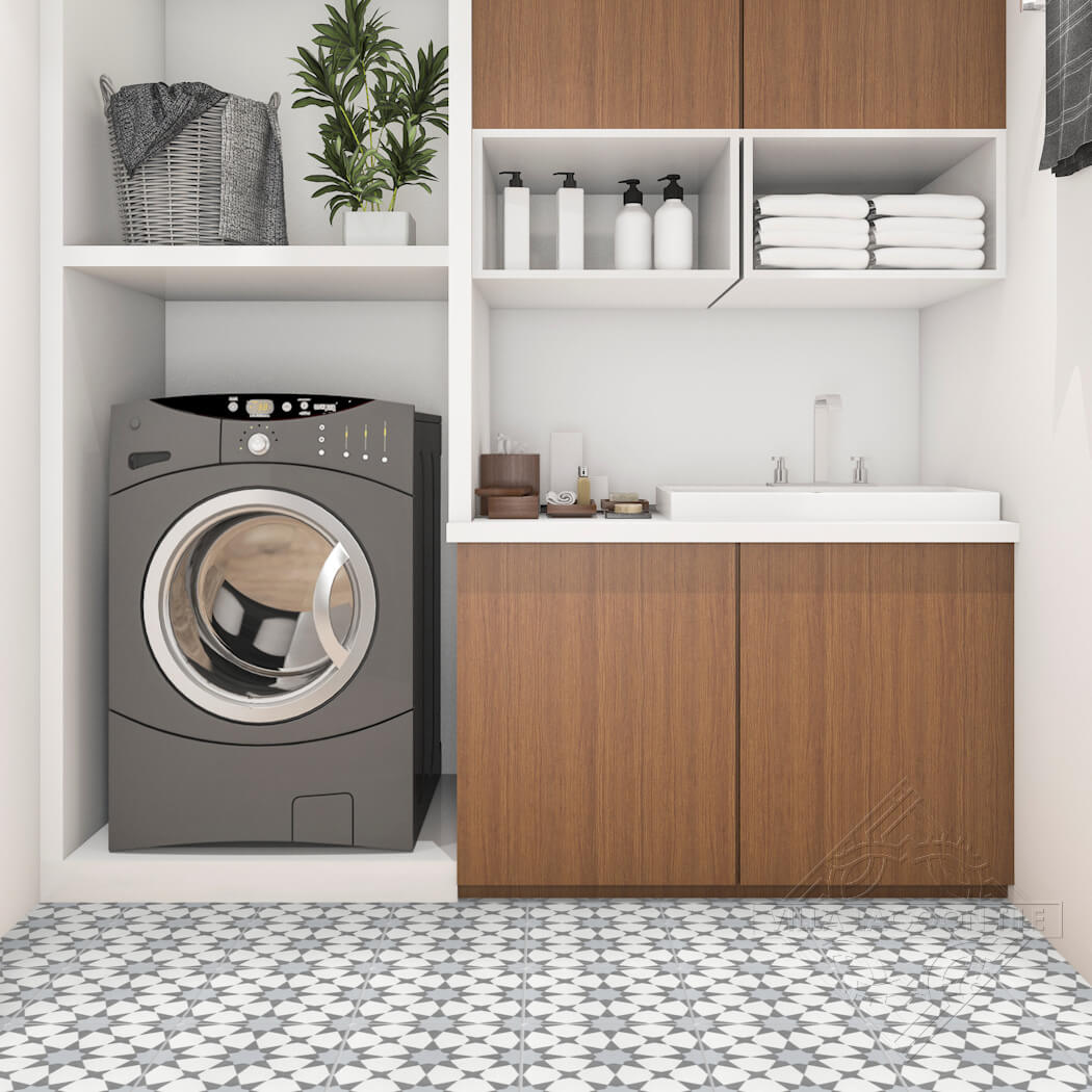 Modern laundry room featuring N20-271 Silver by New York Cement Tile, front-load washer, sink, wooden cabinets, and shelves.