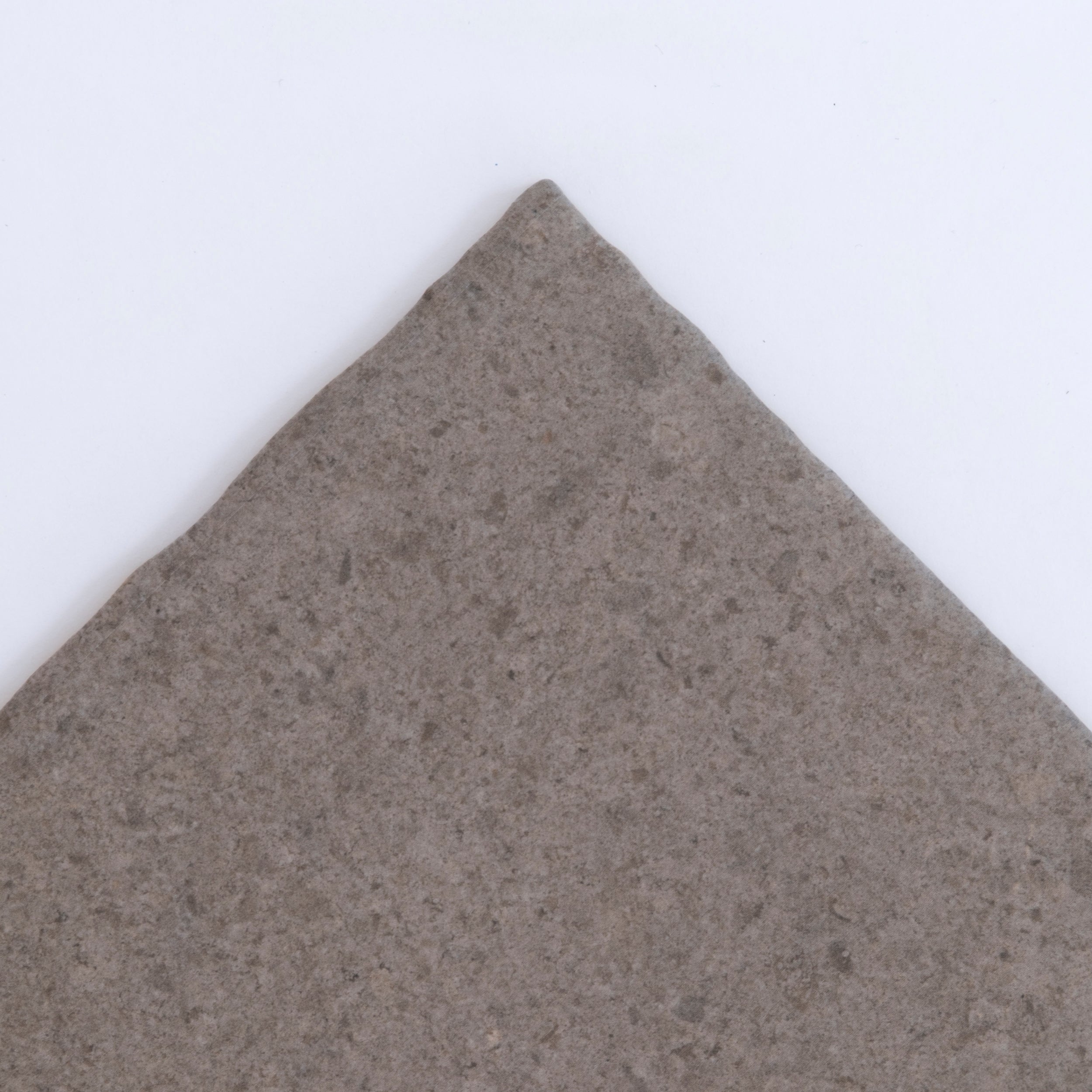 Three Toba Brun R11 tiles by New York Cement Tile are arranged vertically against a plain white background.