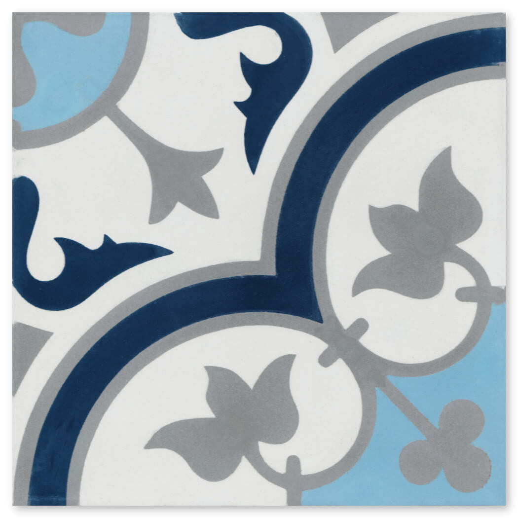 The N20-045 Ice Blue Sample by New York Cement Tile features blue, gray, and navy floral and geometric patterns on white ceramic.
