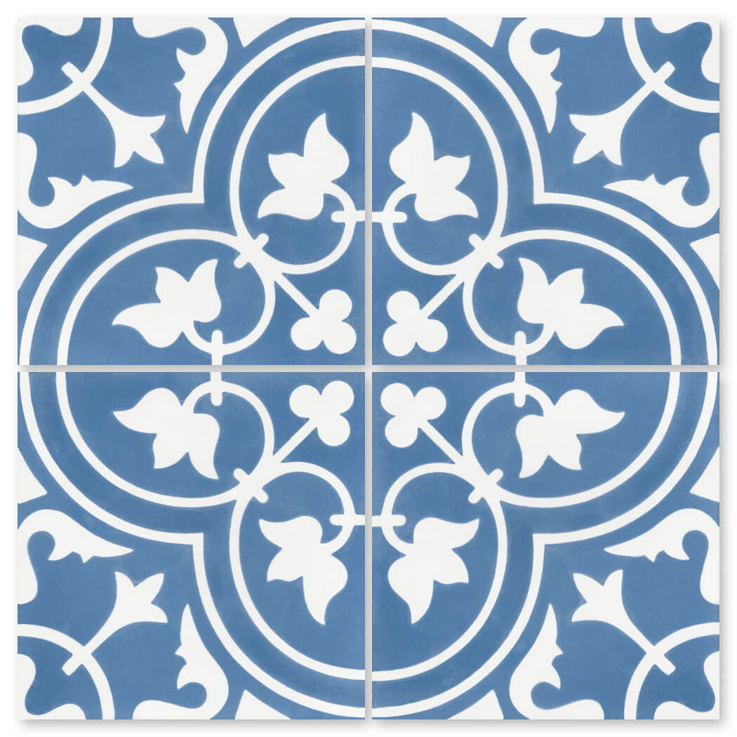The N20-045 Royal Blue Sample by New York Cement Tile features a striking, handcrafted blue and white floral tile pattern.