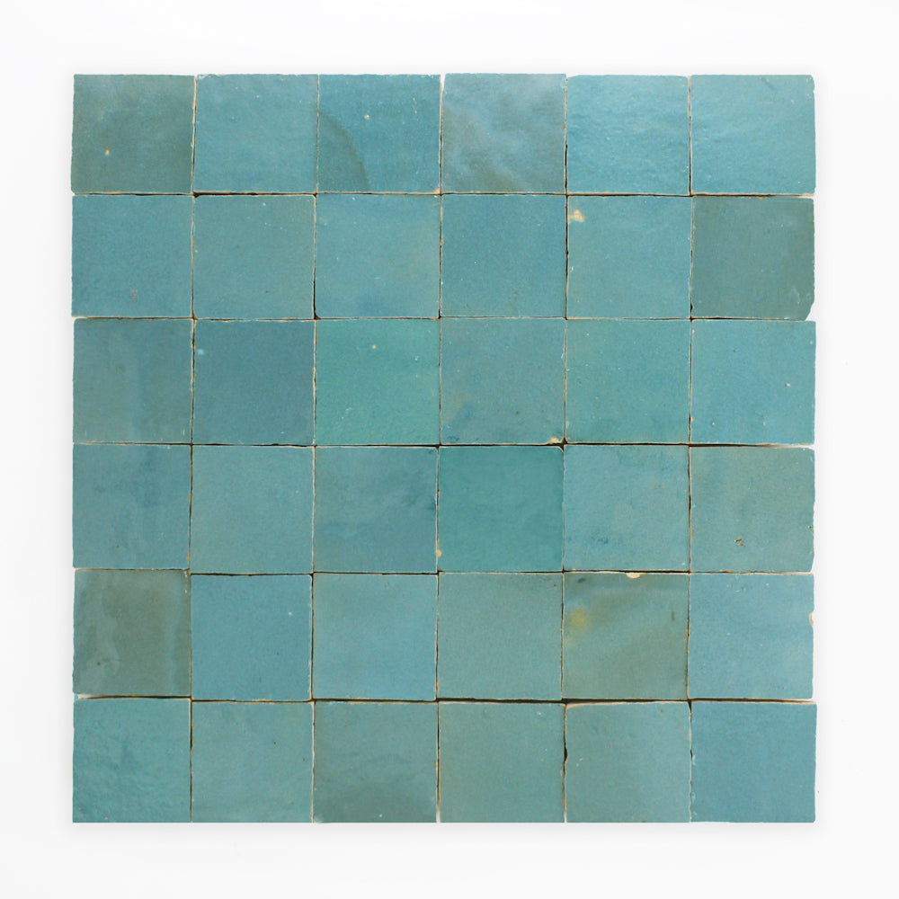 Water line by New York Cement Tile: blue-green square zellige tiles, subtly varied, set on a white background.