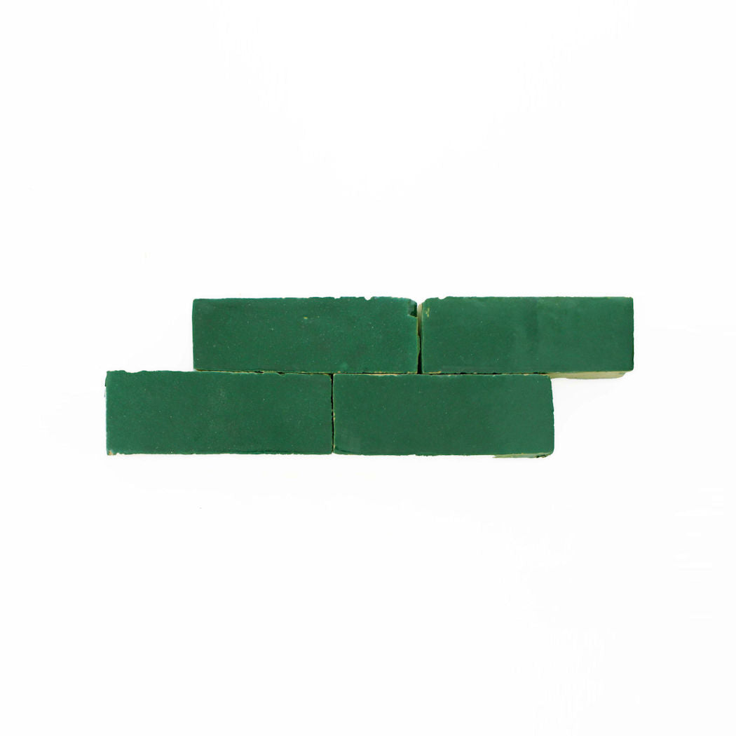 Four Jewel Green (2x6) samples by New York Cement Tile are arranged in a staggered row on a white background.