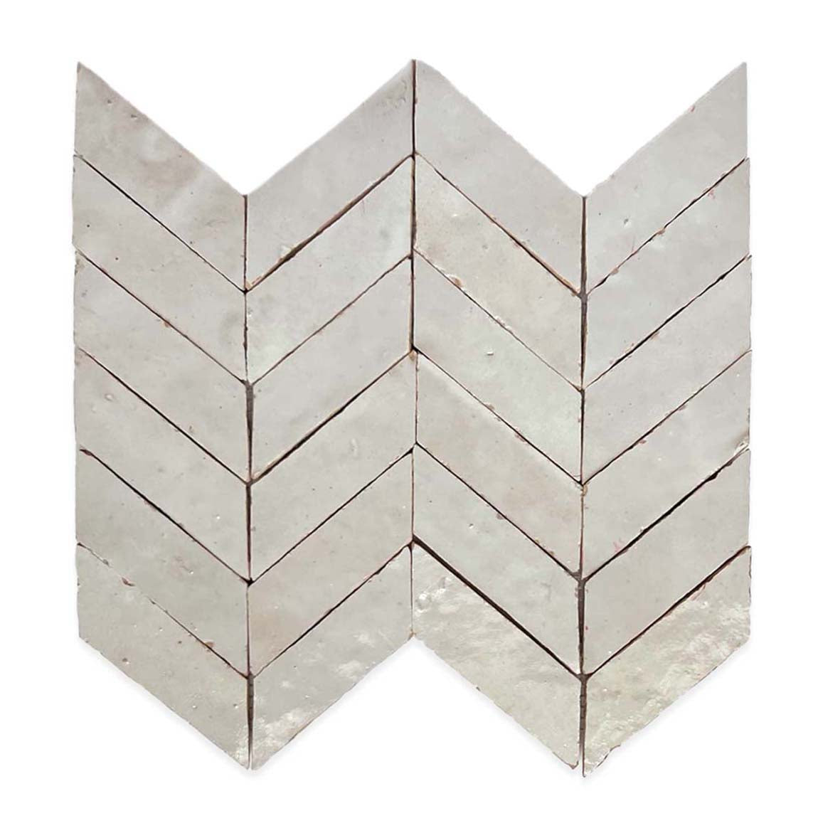 Chevron-patterned white tiles arranged in a V-shape, creating a zigzag design with a slightly glossy and textured surface.