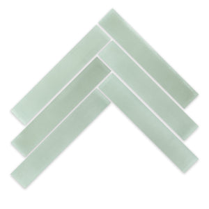 Five 2x12 Solid Pale Jade tiles from New York Cement Tile arranged in a chevron on a white background.
