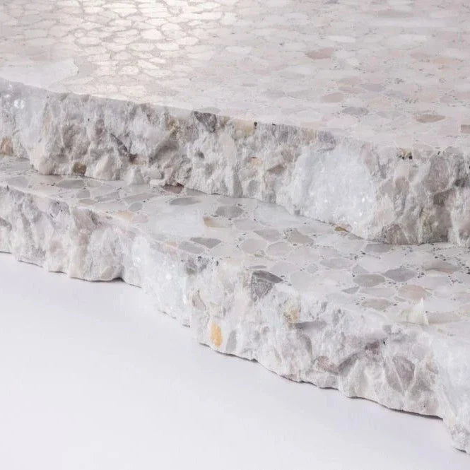 Close-up of TERRAZZO 24X24- Pompano by New York Cement Tile: polished surface, mosaic tiles, textured stone edges.