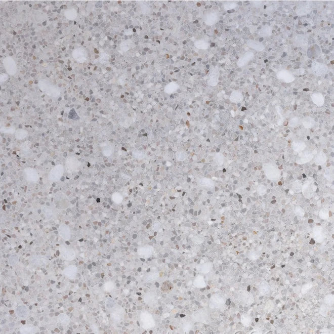 Close-up of TERRAZZO 24X24- Pompano tile by New York Cement Tile, with white and gray chips for durable flooring.