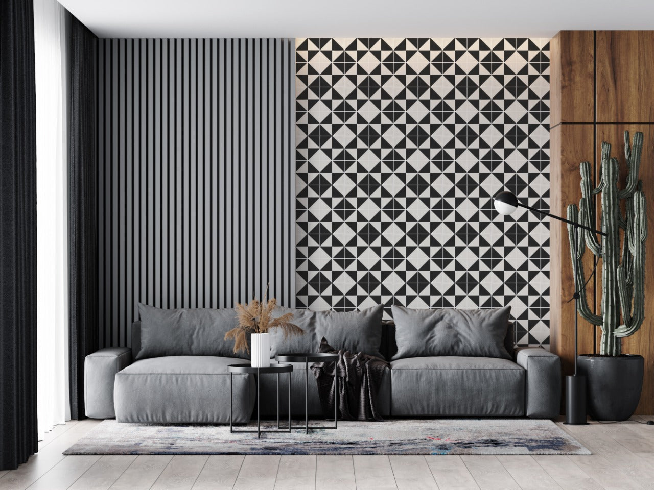 Modern living room with gray sofa, geometric accent wall, wood panels, floor lamp, cactus plant, and small tables.