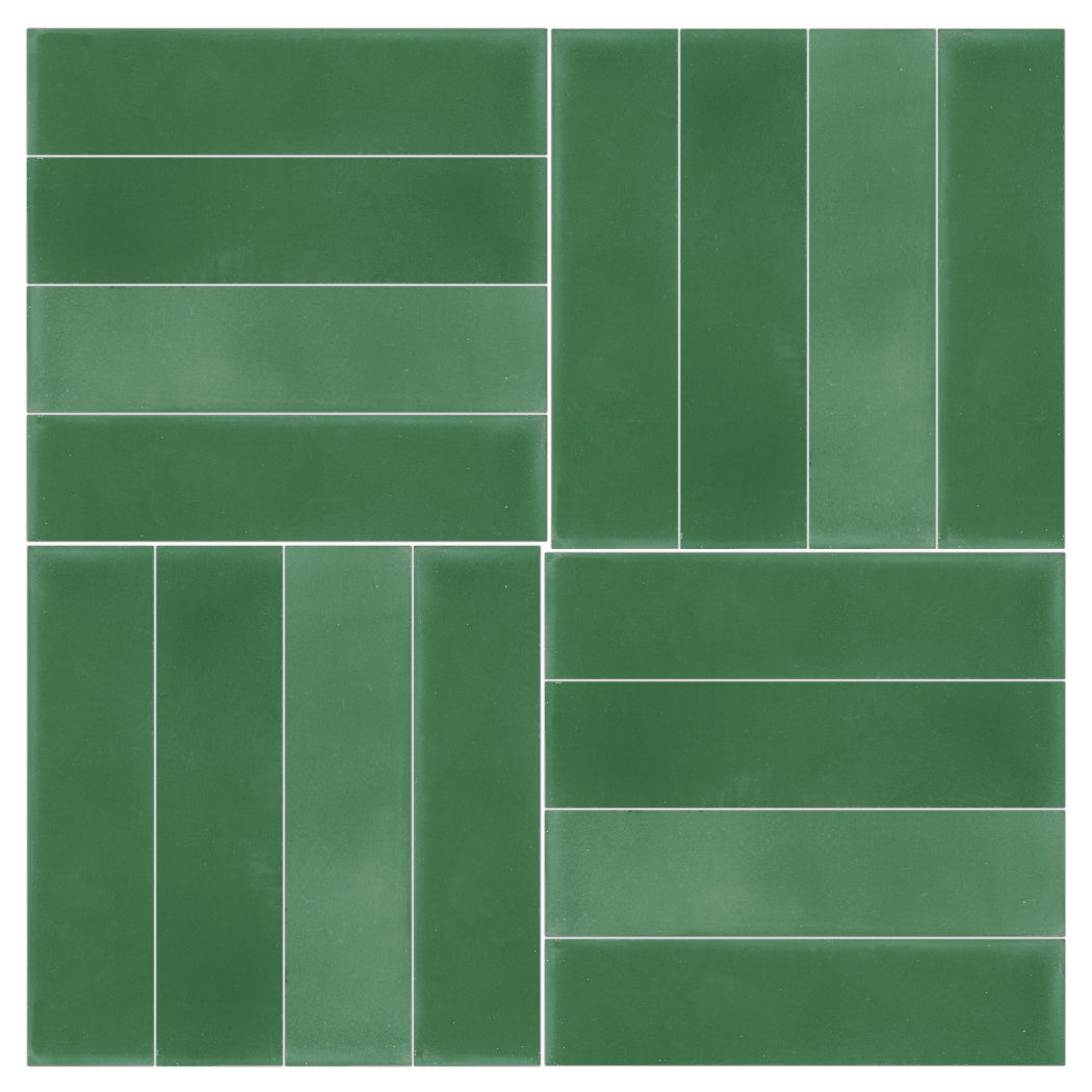 Four 2x8 Solid Verdant Hills tiles by New York Cement Tile form a durable backsplash with alternating patterns and white grout.