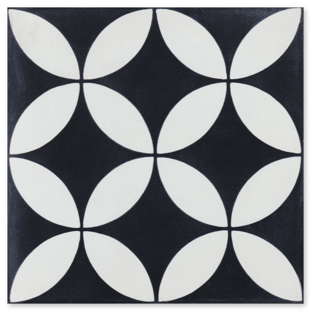 The N20-061 Black, Extra Sample by New York Cement Tile features white petal-like geometric patterns on a black base.