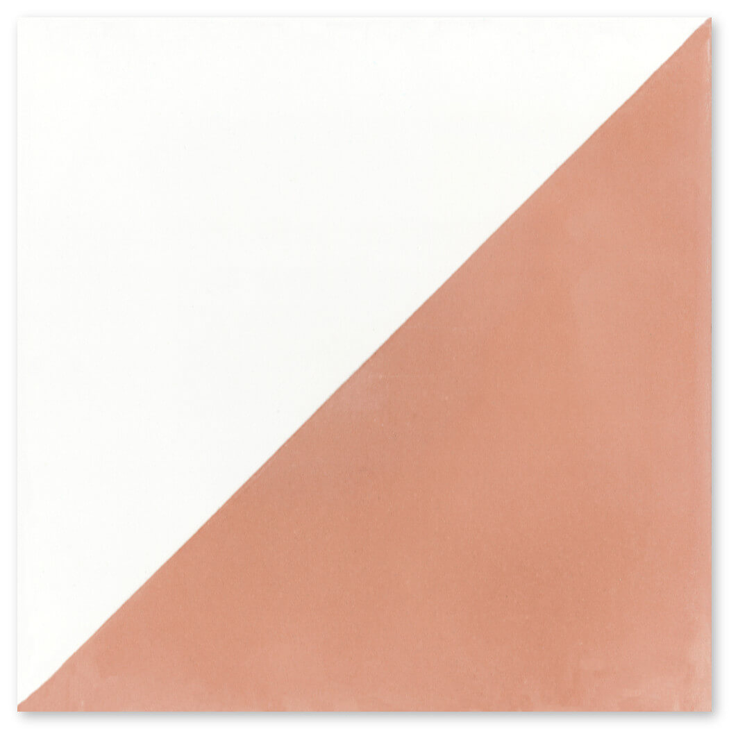 The N20-139 Misty Coral & White tile by New York Cement Tile is diagonally split, half white, half muted terracotta.