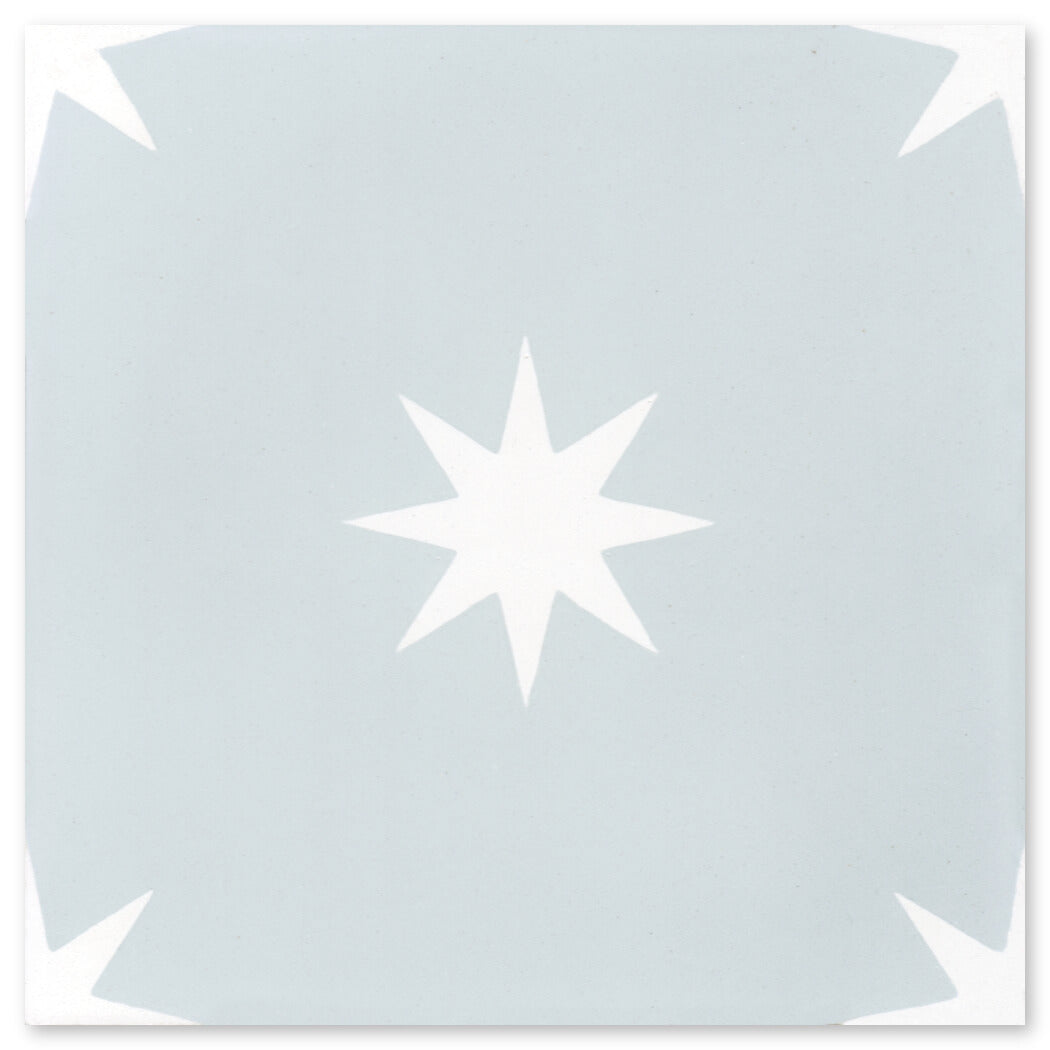 N20-572 Baby Blue by New York Cement Tile: light blue tile with white star, ideal for durable floors or stylish accents.