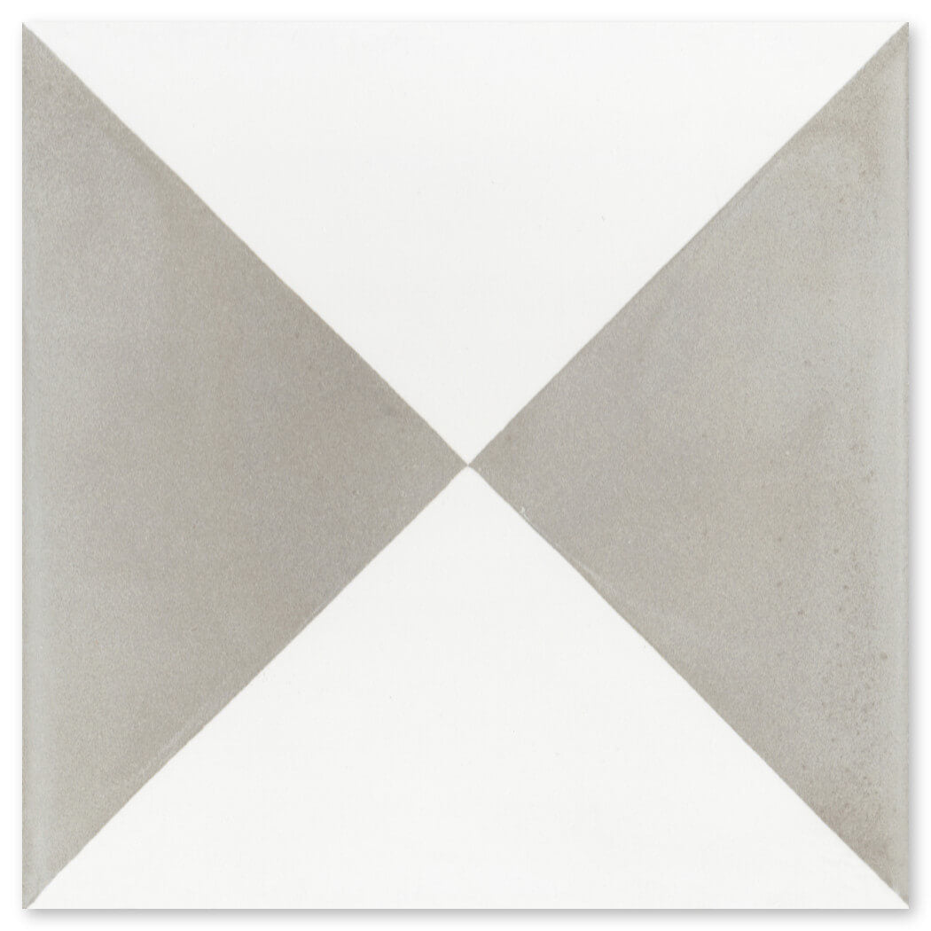 The N20-032 Grey & White tile by New York Cement Tile features grey triangles on white—stylish and durable for flooring.