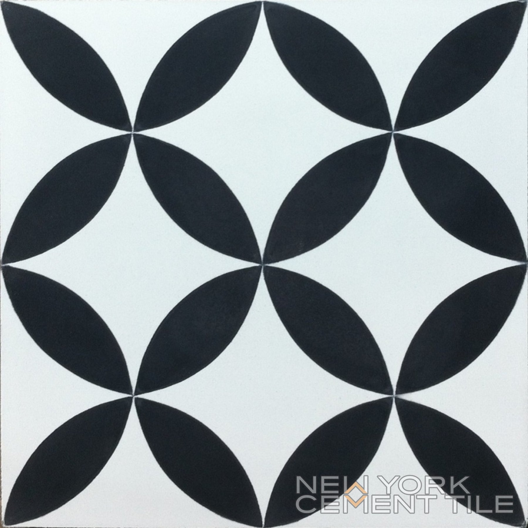 Black overlapping leaves form a geometric pattern on white. N20-061/062 by New York Cement Tile logo in the corner.