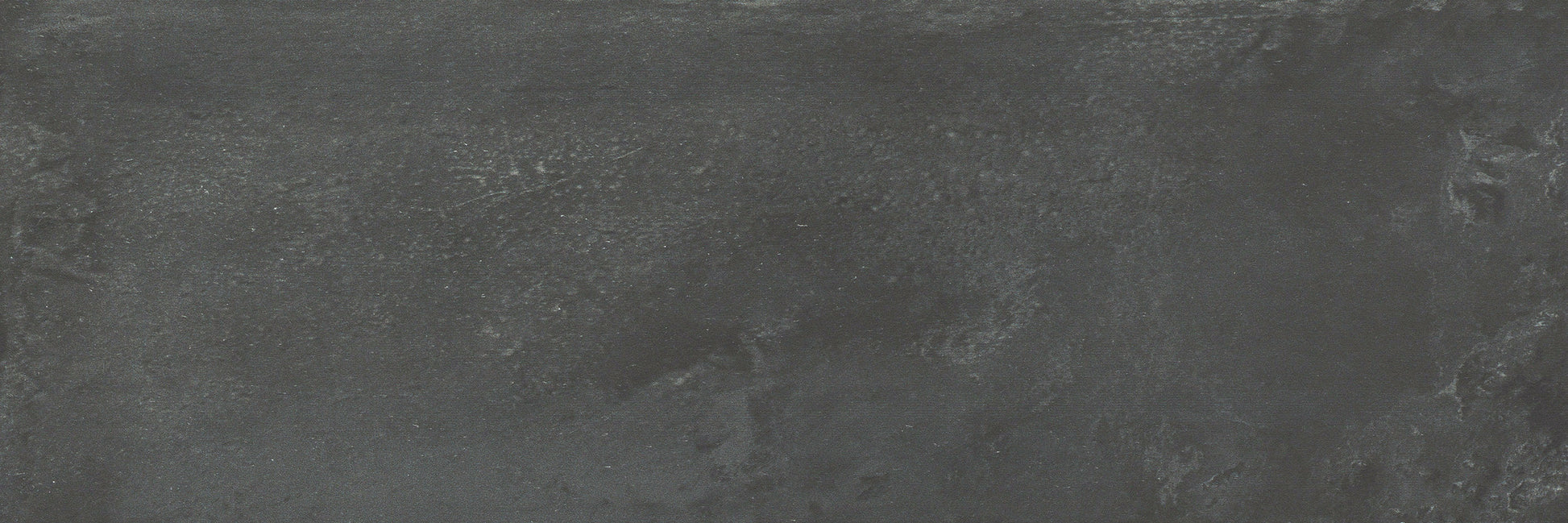 Contra Black, Extra Sample by New York Cement Tile features a textured dark gray and black surface with subtle matte patterns.