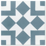 The N20-217 by New York Cement Tile features blue squares and diamonds in a geometric pattern on a white background.