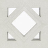 Antil Sample by New York Cement Tile: white geometric diamond and triangle pattern on light gray, mid-century modern style.