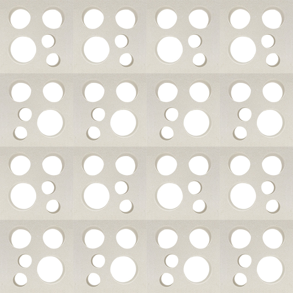 Jami by New York Cement Tile: grid of rectangles with circular cut-outs, inspired by mid-century breeze blocks.