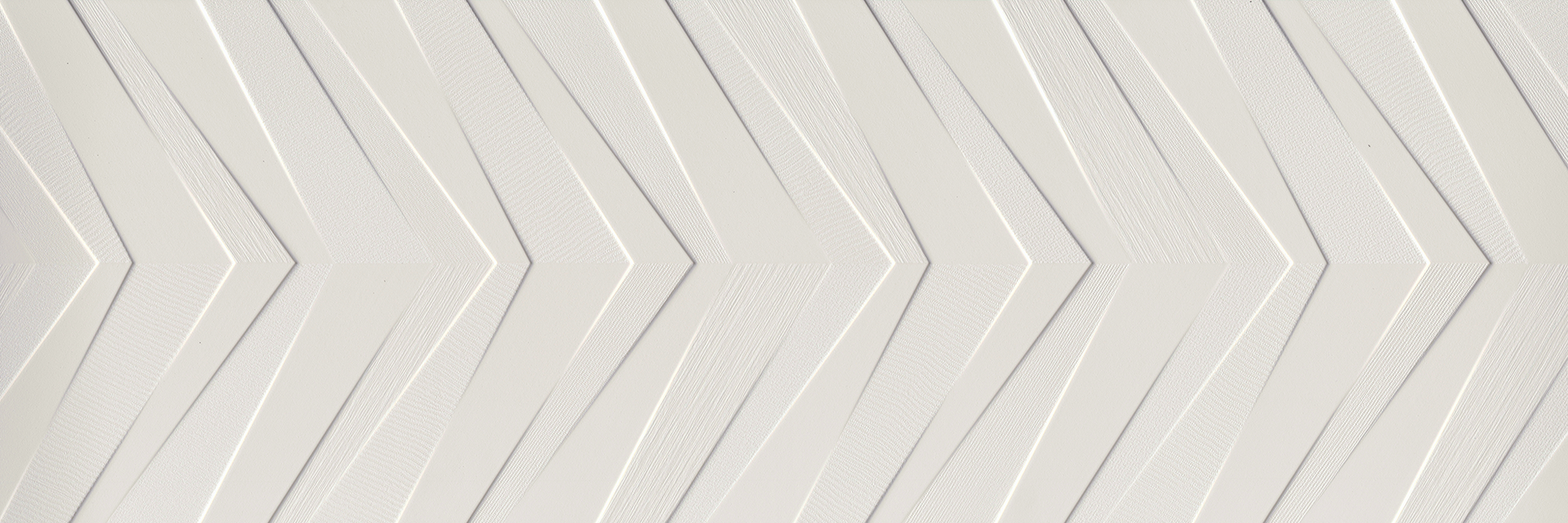 White Chevron - Sample by New York Cement Tile: white ceramic tile with embossed chevron lines for a textured geometric look.