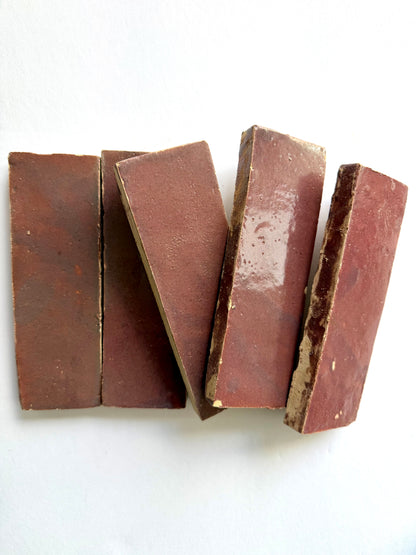 Five Thistle (2x6) tiles by New York Cement Tile are arranged side by side on a white surface.