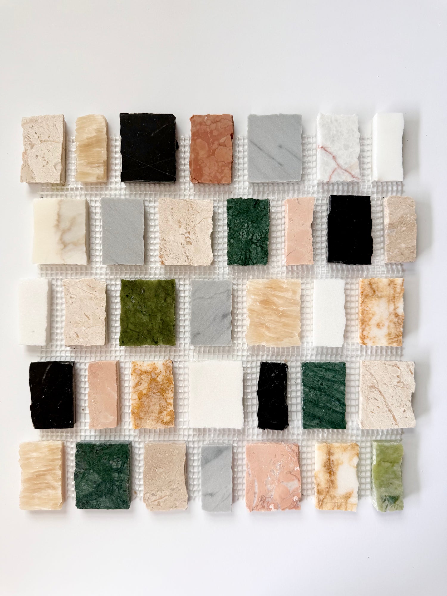 Scarpa I Multicolors Mosaic Marble Mesh by New York Cement Tile arranged in a grid on a white background.