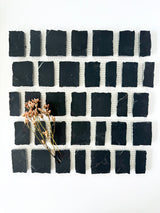 Scarpa I Black Mosaic Marble Mesh by New York Cement Tile, featuring grid design with dried flowers from the Mesh Collection.