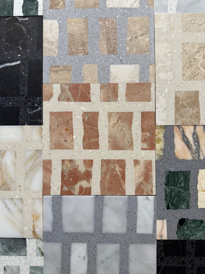 Carlo Scarpa-Earth tiles by New York Cement Tile feature a patchwork grid of colorful rectangular marble and stone.