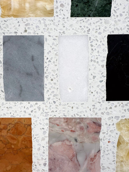 Carlo Scarpa-Multicolor by New York Cement Tile: multicolor rectangular tiles in a terrazzo-style white concrete background.