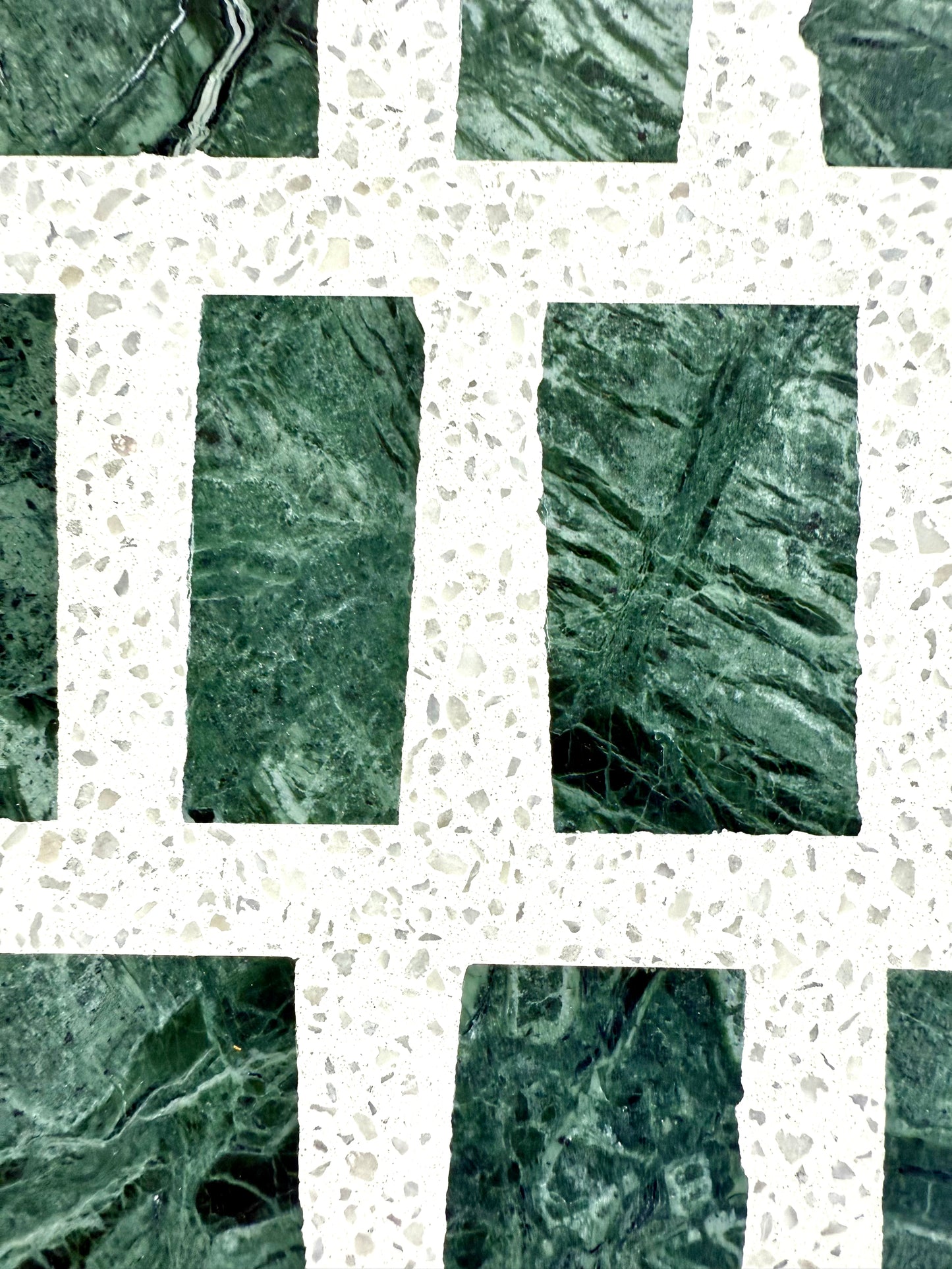 Carlo Scarpa - Emerald Green by New York Cement Tile: green marble tiles with white terrazzo strips in a veined grid pattern.