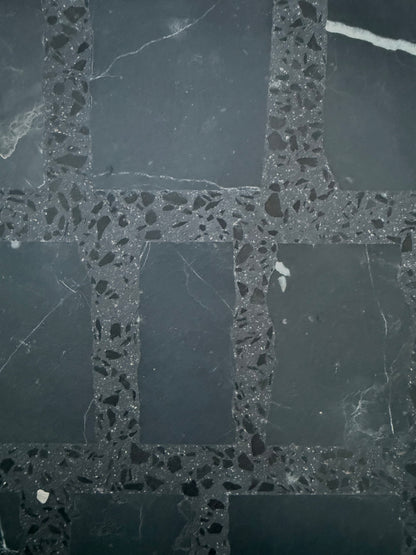 Carlo Scarpa-Black by New York Cement Tile: dark grid floor with terrazzo borders and slate-style squares.