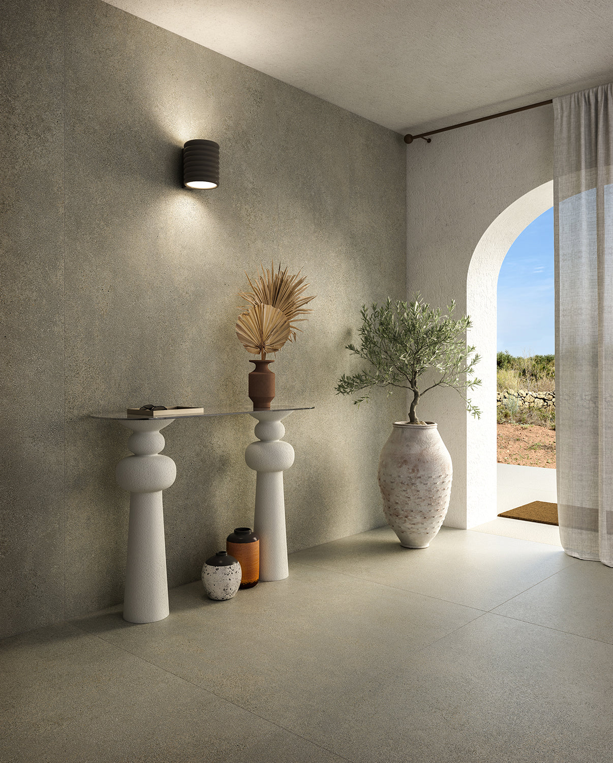 Minimalist entryway in earthy style with the Lake console by New York Cement Tile, dried plants, and natural tones.