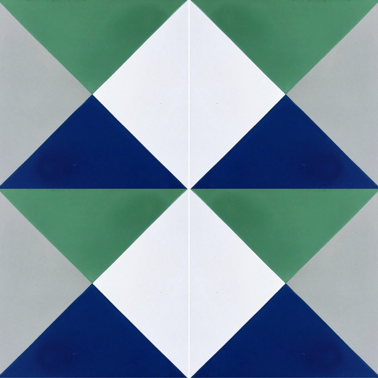 N20-032 by New York Cement Tile features green, blue, white & gray triangles forming diamonds on durable cement flooring.