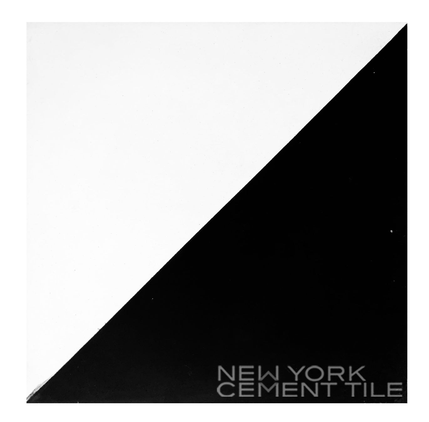 A square N20-139 tile, split diagonally black and white, features handcrafted detail and New York Cement Tile branding.
