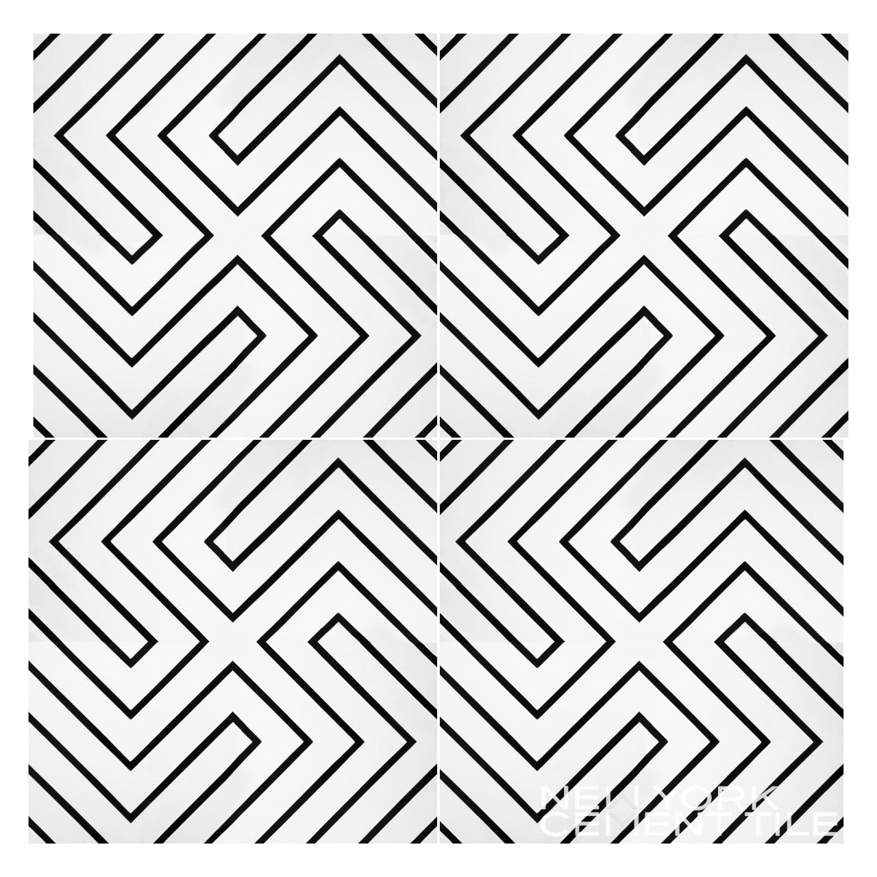 Black zigzag lines create a geometric maze on four N20-437 tiles by New York Cement Tile, meeting at a central diamond.
