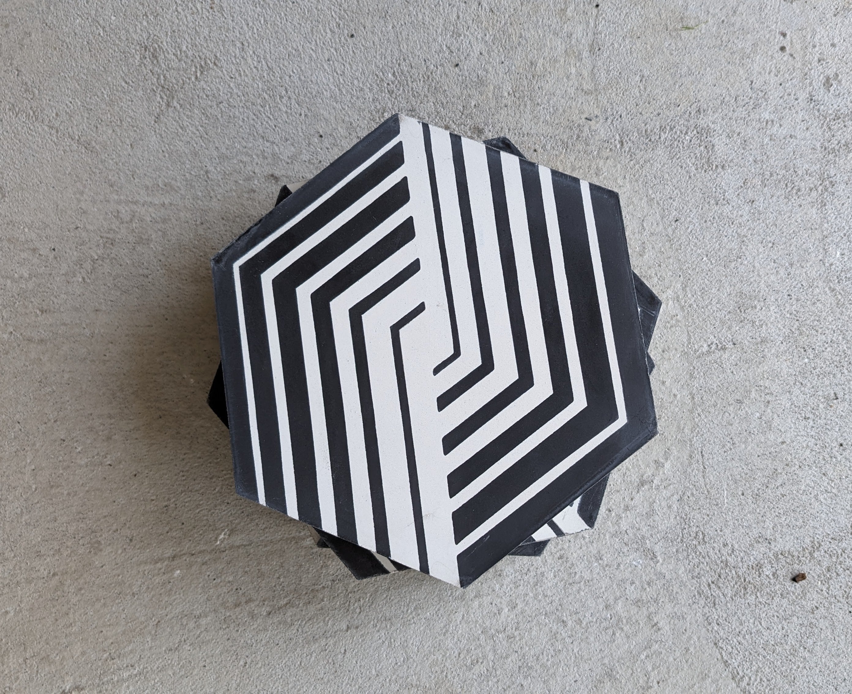 NL23-7 hexagon tile by New York Cement Tile features black and white maze lines for a modern, handcrafted look.
