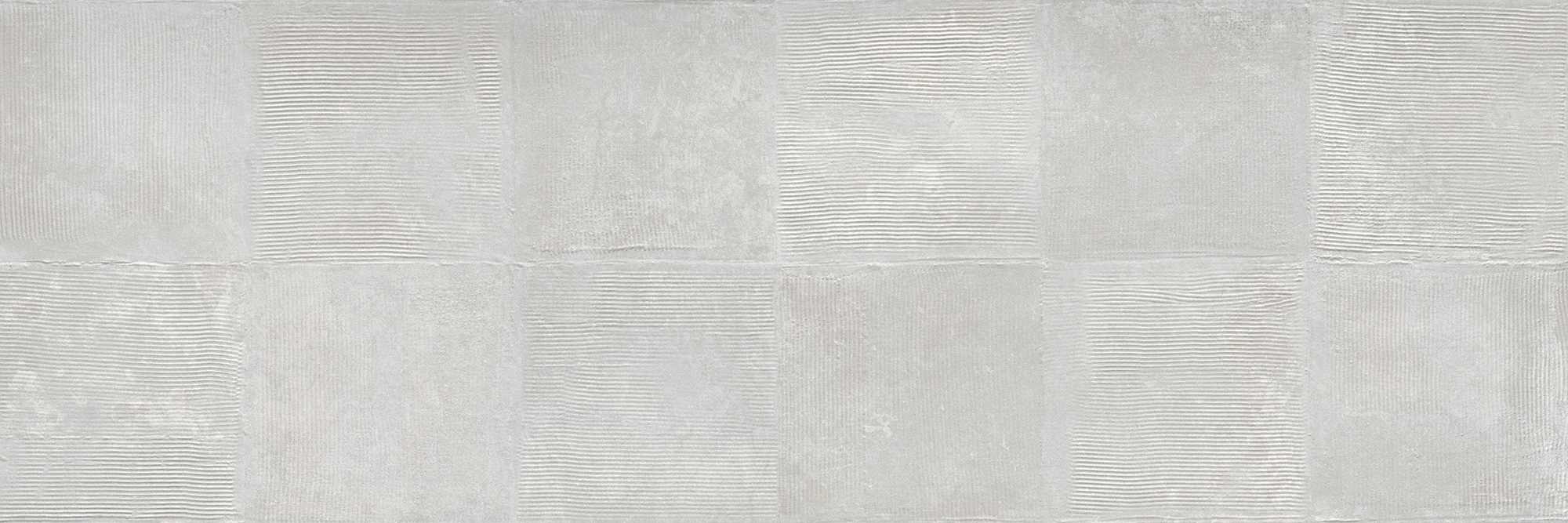 Gray Plaster by New York Cement Tile: large format light gray ceramic tiles with alternating smooth and lined patterns.