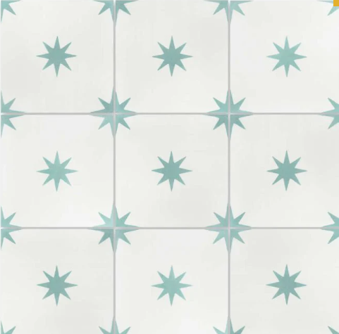 The Pleiades A In Sea Glass tile from New York Cement Tile has blue eight-pointed stars, perfect for durable flooring.