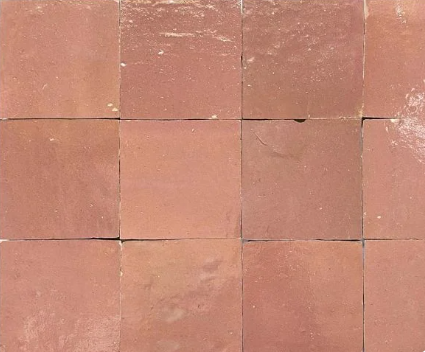 Twelve Glazed Copper Rose tiles by New York Cement Tile, in a 3x4 grid, each with unique shades and textures.